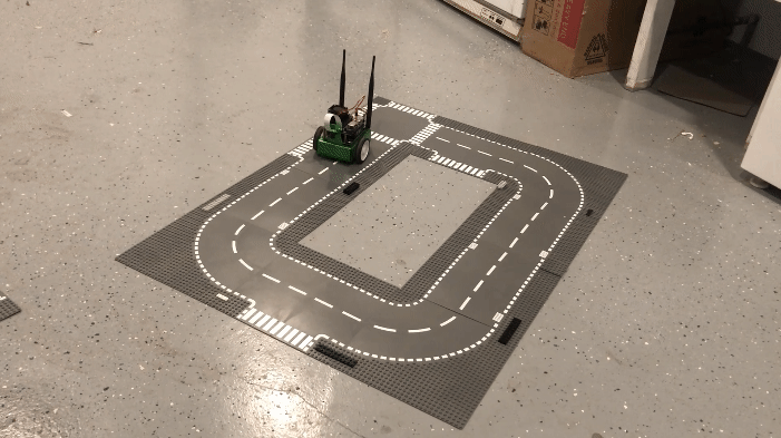 GIF shows real JetBot following the track.