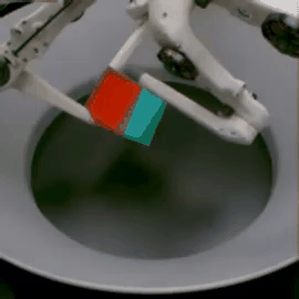GIF of a robot picking up a 3D cube with a poor grip and the cube falling down.
